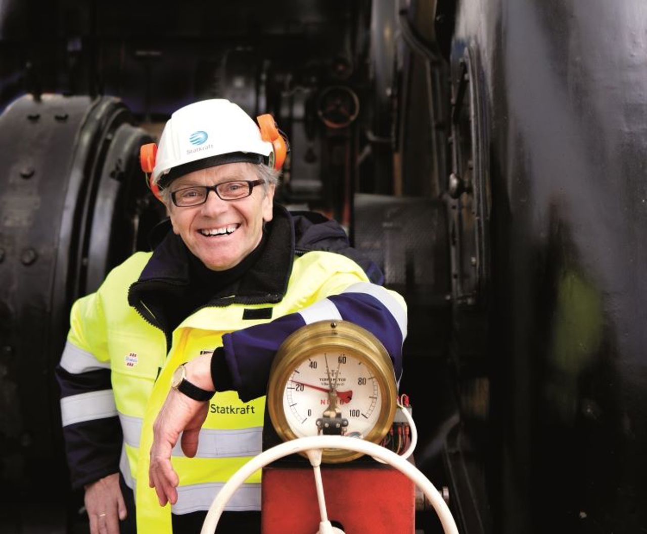 Smiling employee inside power plant