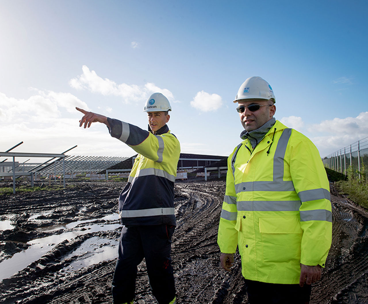 Worker in front of solar plant