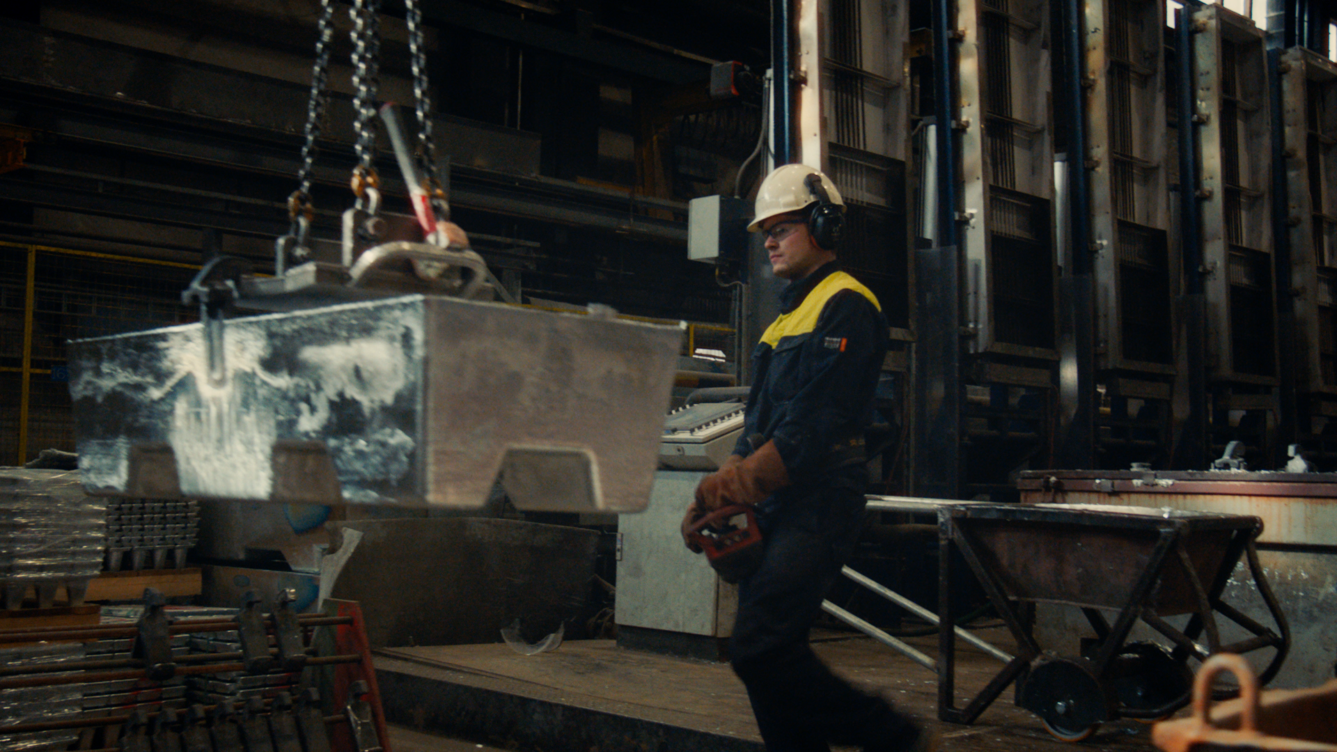 Man in protective gear inside a production facility